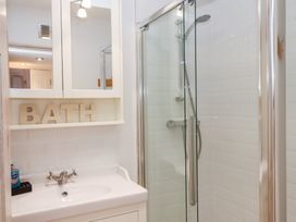 A bathroom with a shower and sink at 13 Above Town in Dartmouth