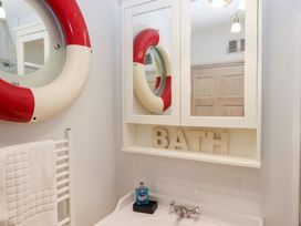 A bathroom with a towel rack and a sink at 13 Above Town in Dartmouth