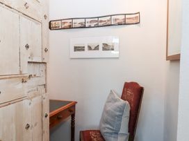 A small room with a chair and table at 13 Above Town in Dartmouth