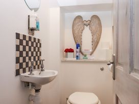 A bathroom with a sink and toilet at 13 Above Town in Dartmouth