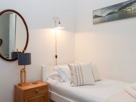 A bedroom with a single bed and a lamp at 13 Above Town in Dartmouth