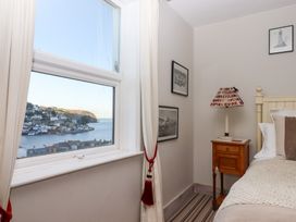 A bedroom with a view of the harbor at 13 Above Town Dartmouth