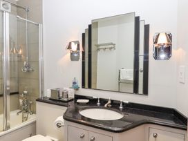 A bathroom with a shower, sink, and toilet at 13 Above Town in Dartmouth