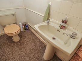 A bathroom with a toilet and sink at Dollar Ward House Basement Cirencester