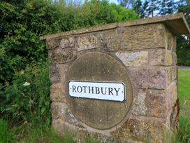 A stone sign displaying the name Rothbury