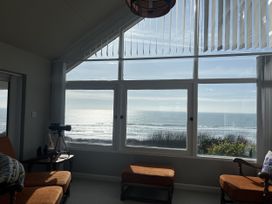 A living room with a view of the ocean at Stonecroft in Praa Sands