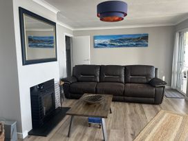 A living room with a sofa and coffee table at Stonecroft in Praa Sands