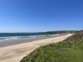 A beach with sand and waves at Stonecroft in Praa Sands