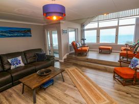 A living room with a sofa and coffee table at Stonecroft in Praa Sands