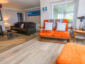 A living room with a sofa and coffee table at Stonecroft in Praa Sands