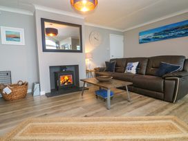 A living room with a sofa and coffee table at Stonecroft in Praa Sands