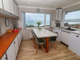 A kitchen with a table and chairs at Stonecroft in Praa Sands