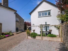 A house with a pathway and plants at The Stables in St Athan
