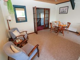 A dining room with a table and chairs at The Stables in St Athan