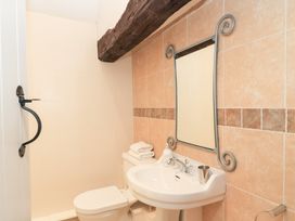 A bathroom with a sink and toilet at Butlers Cottage in Burford
