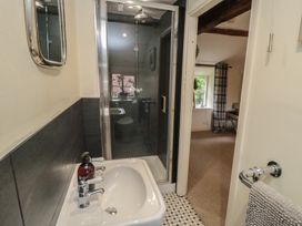 A bathroom featuring a sink and shower at Black Horse Cottage in Swainby