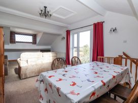 A dining room with a table and chairs at East Cottage in East Knapton near Rillington