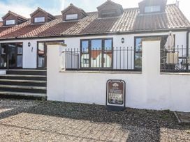 Exterior view of West Cottage with steps and parking sign at West Cottage in East Knapton near Rillington