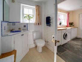 A bathroom with sink and toilet at Porthcothan House in Porthcothan