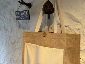 A bag hanging on a wall with a private sign at The Captain's Nest in Bunbeg, County Donegal