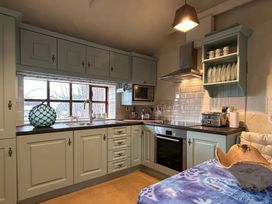 A kitchen with a sink and cabinets at The Captain's Nest in Bunbeg, County Donegal