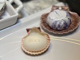 A soap in a shell dish with a label at The Captain's Nest in Bunbeg, County Donegal
