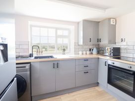 A kitchen with countertop and appliances at Burgedin Locks Cottage Arddleen near Llandrinio