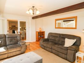 A living room with sofas and a coffee table at 3 Town Farm Court, Newton Abbot