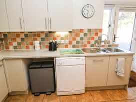 A kitchen with appliances and fittings at 3 Town Farm Court in Newton Abbot