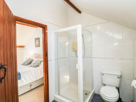 A bathroom with a shower and toilet at 3 Town Farm Court in Newton Abbot