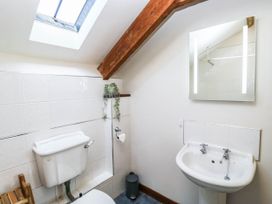 A bathroom with a toilet and sink at 3 Town Farm Court, Newton Abbot