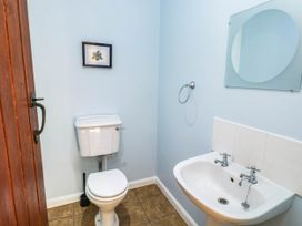 A bathroom with a toilet and sink at 3 Town Farm Court Newton Abbot