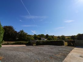 An outdoor view with trees and gravel area at 3 Town Farm Court Newton Abbot