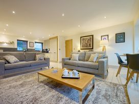 A living room with sofas and a coffee table at Riverside Park 1 in Keswick