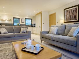 A living room with a sofa and coffee table at Riverside Park 1 in Keswick