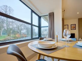 A dining room with a table set for meals at Riverside Park 1 in Keswick