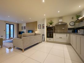 A living room with a sofa and coffee table at Riverside Park 1 in Keswick