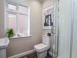 A bathroom with a toilet and shower at 24 Baxtergate in Whitby