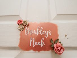 A nameplate on a door reading Brinkleys Nook