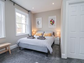 A bedroom with a bed and bedside table at 24 Baxtergate, Whitby