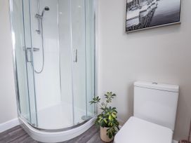A bathroom with a shower and a toilet at 24 Baxtergate in Whitby