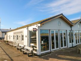 An outdoor view of a seaside building at The Old Boathouse in Amble
