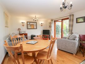 A living room with a table and chairs at Low Dow Crag in Coniston