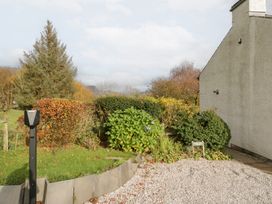 An outdoor area with bushes and a tree at Low Dow Crag in Coniston