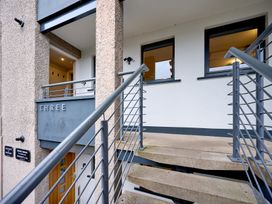 An exterior view of an apartment entrance with stairs at Riverside Park 3 Keswick