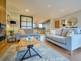 A living room with sofas and a coffee table at Riverside Park 3 in Keswick