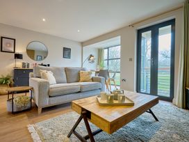A living room with a sofa and coffee table at Riverside Park 3 in Keswick