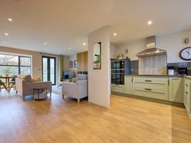 A kitchen with a seating area and television at Riverside Park 3 in Keswick