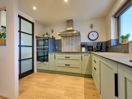 A kitchen with appliances and cabinetry at Riverside Park 3 in Keswick