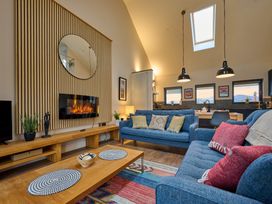 A living room with a sofa and coffee table at Riverside Park 5 in Keswick